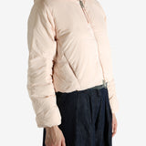 Pink jacket worn by a person, showing the jacket's fit