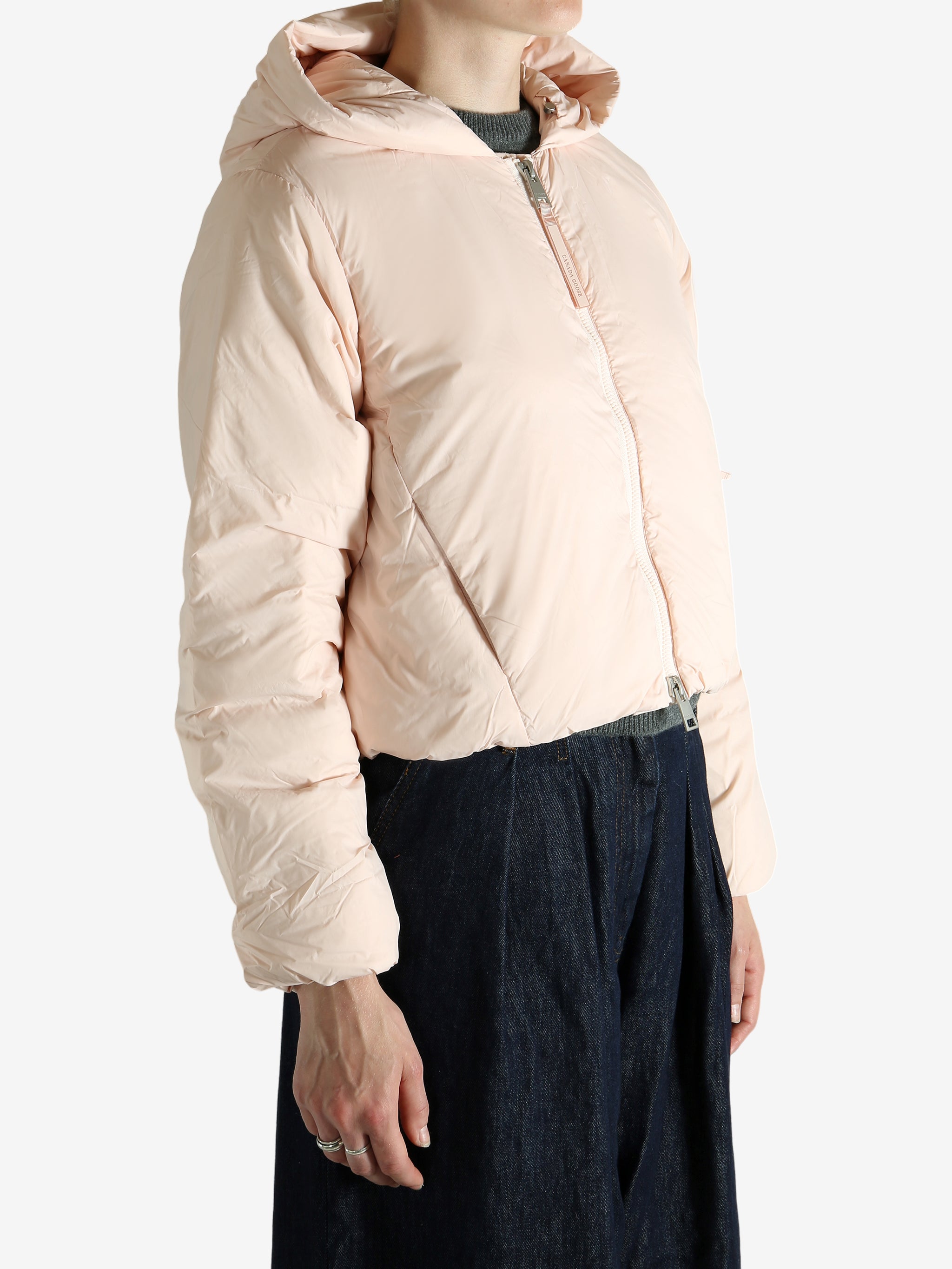 Pink jacket worn by a person, showing the jacket's fit