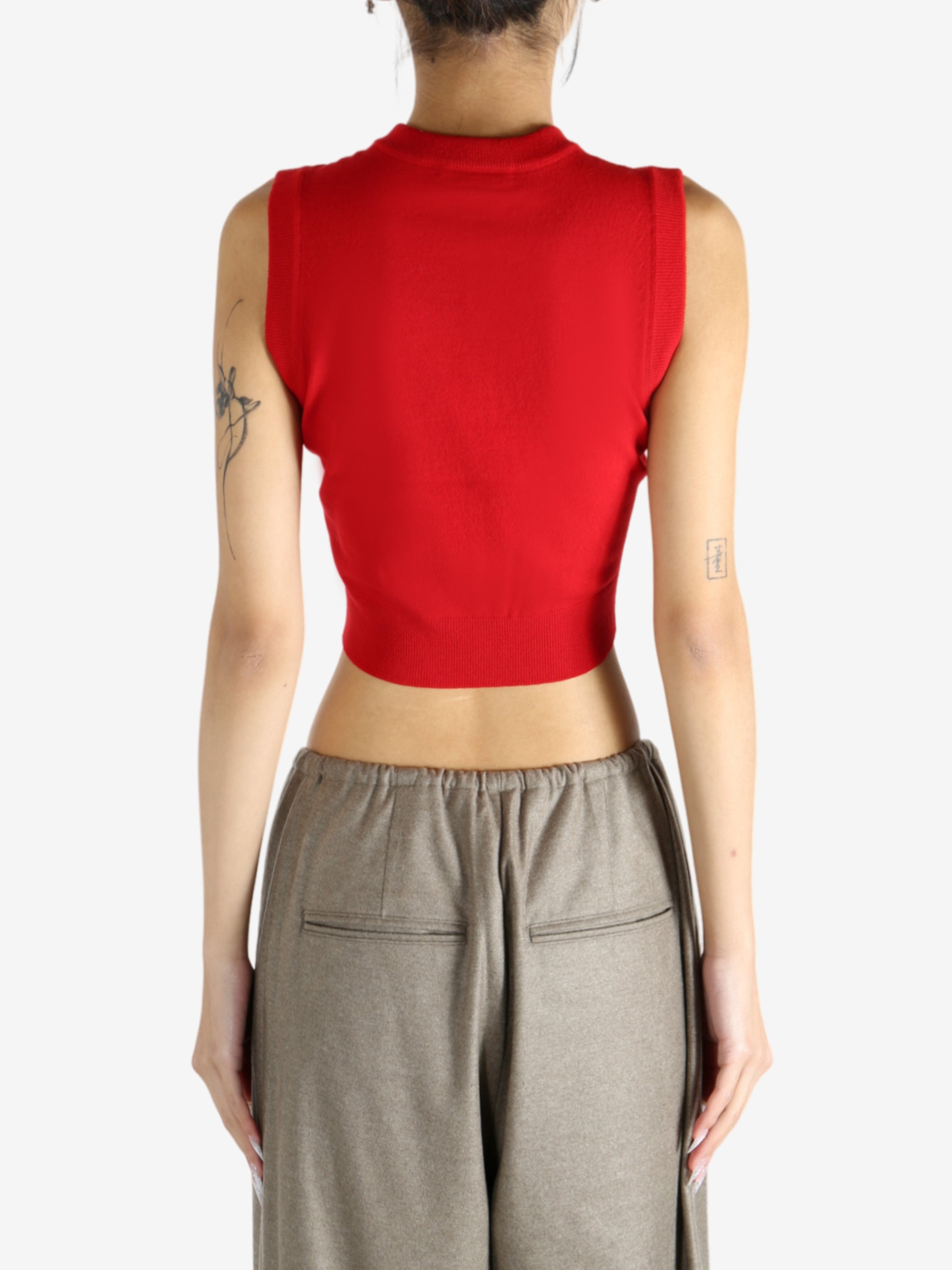 Red top worn by a person, showing the top's fit