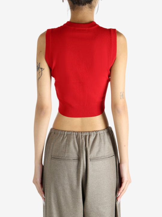 Red top worn by a person, showing the top's fit