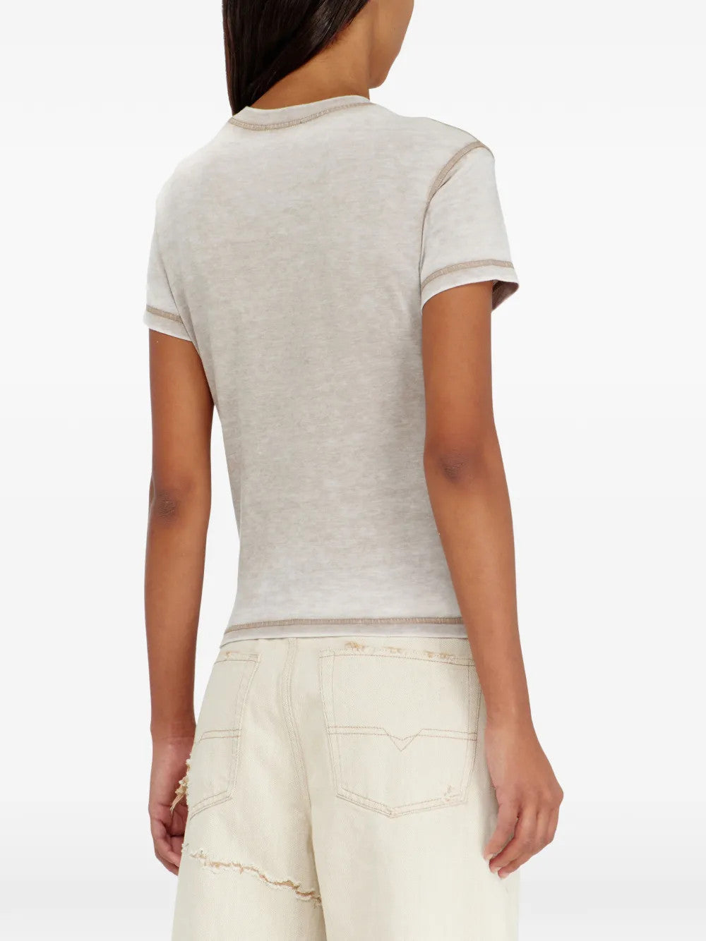 Tan t-shirt worn by a person, showing the t-shirt fit