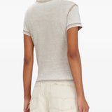 Tan t-shirt worn by a person, showing the t-shirt fit