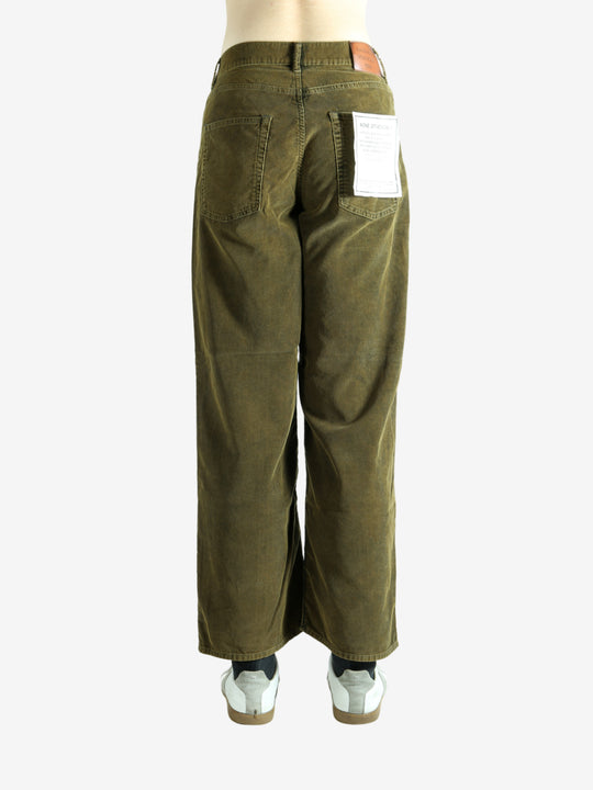 Green pant worn by a person, showing the pant's fit