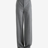 Grey pants worn by a person, showing the pant's fit