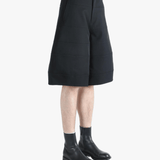 Black shorts worn by a person, showing the shorts fit