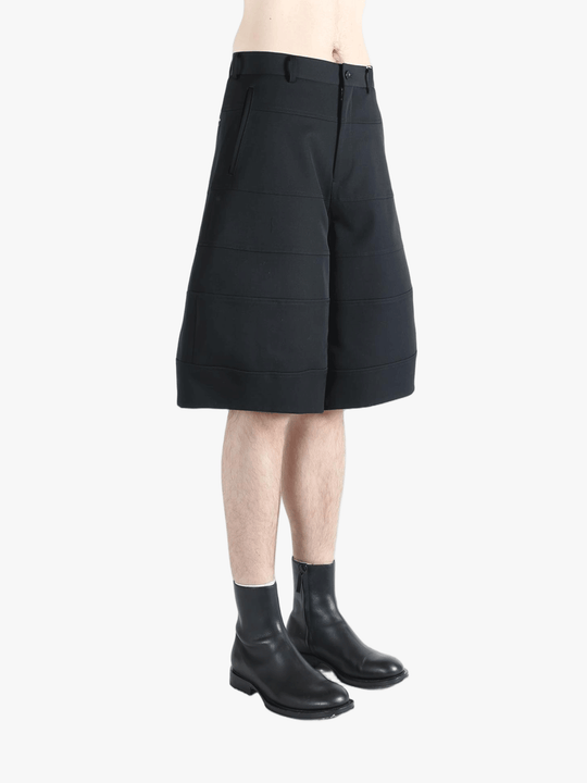 Black shorts worn by a person, showing the shorts fit