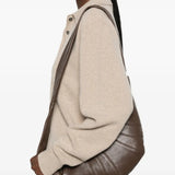 Brown bag worn by a person, showing the bag fit