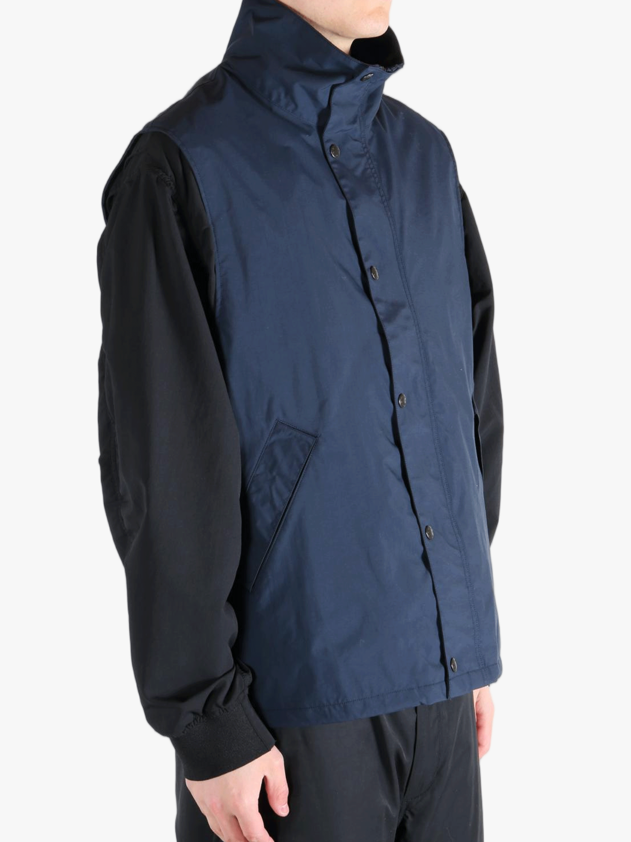 Blue tops worn by a person, showing the tops fit