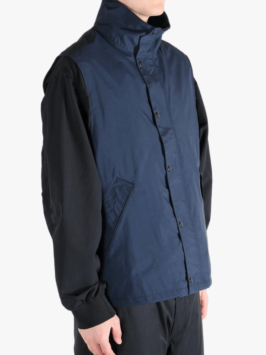 Blue tops worn by a person, showing the tops fit