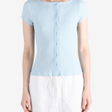 Blue knitwear worn by a person, showing the knitwear fit