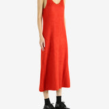 Red dress worn by a person, showing the dress's fit