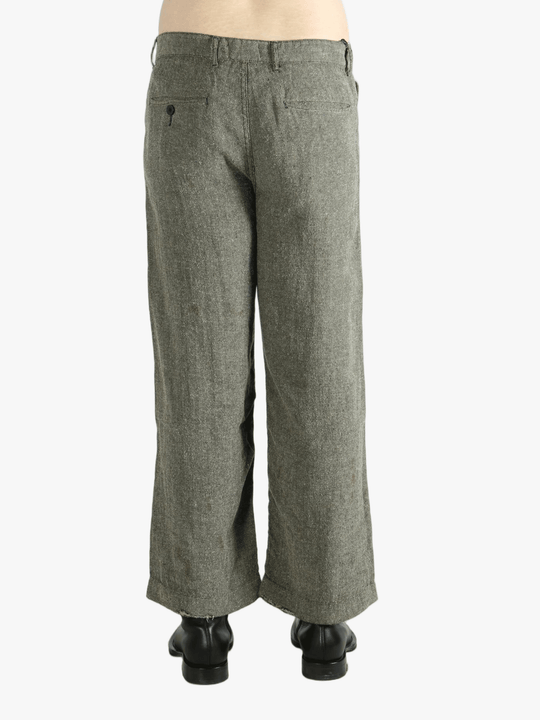 Grey pants worn by a person, showing the pants fit