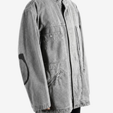 Grey jacket worn by a person, showing the jacket fit