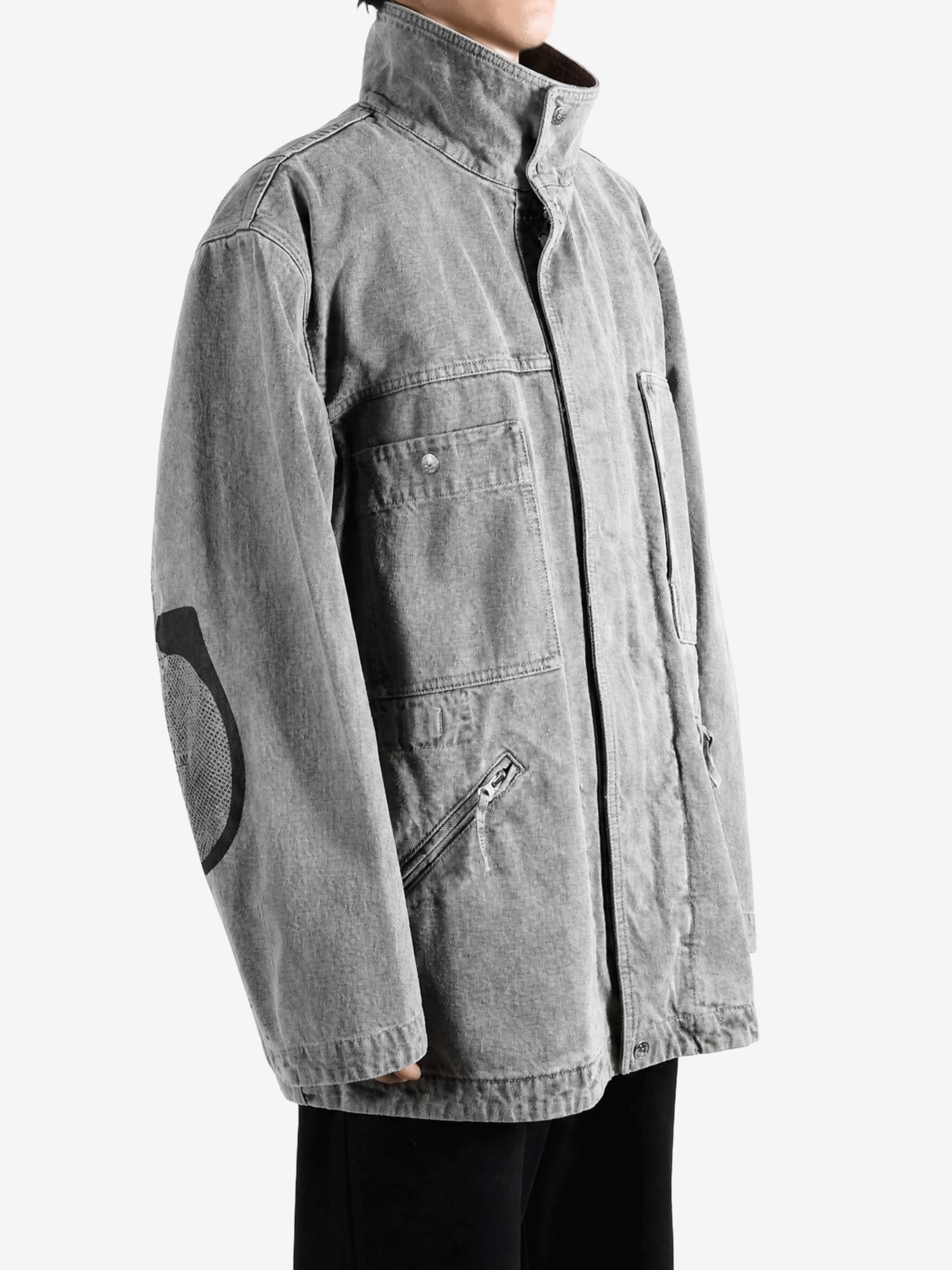 Grey jacket worn by a person, showing the jacket fit