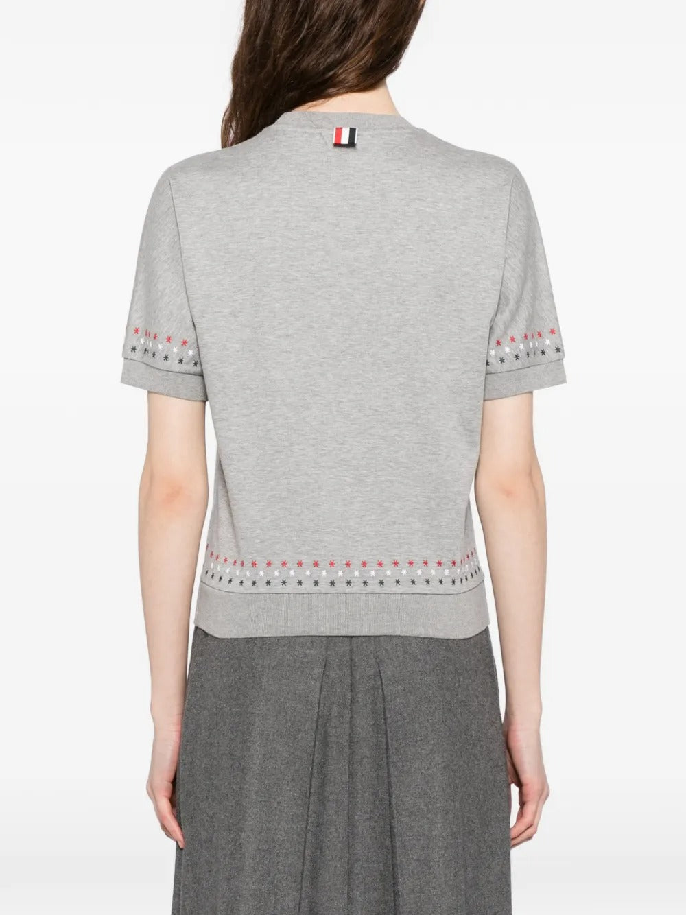 Grey t-shirt worn by a person, showing the t-shirt's fit