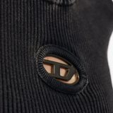 Close up of black knitwear, showing texture of the Cotton fabric