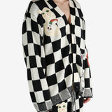 Black cardigan worn by a person, showing the cardigan’s fit