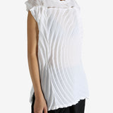 White shirt worn by a person, showing the shirt's fit