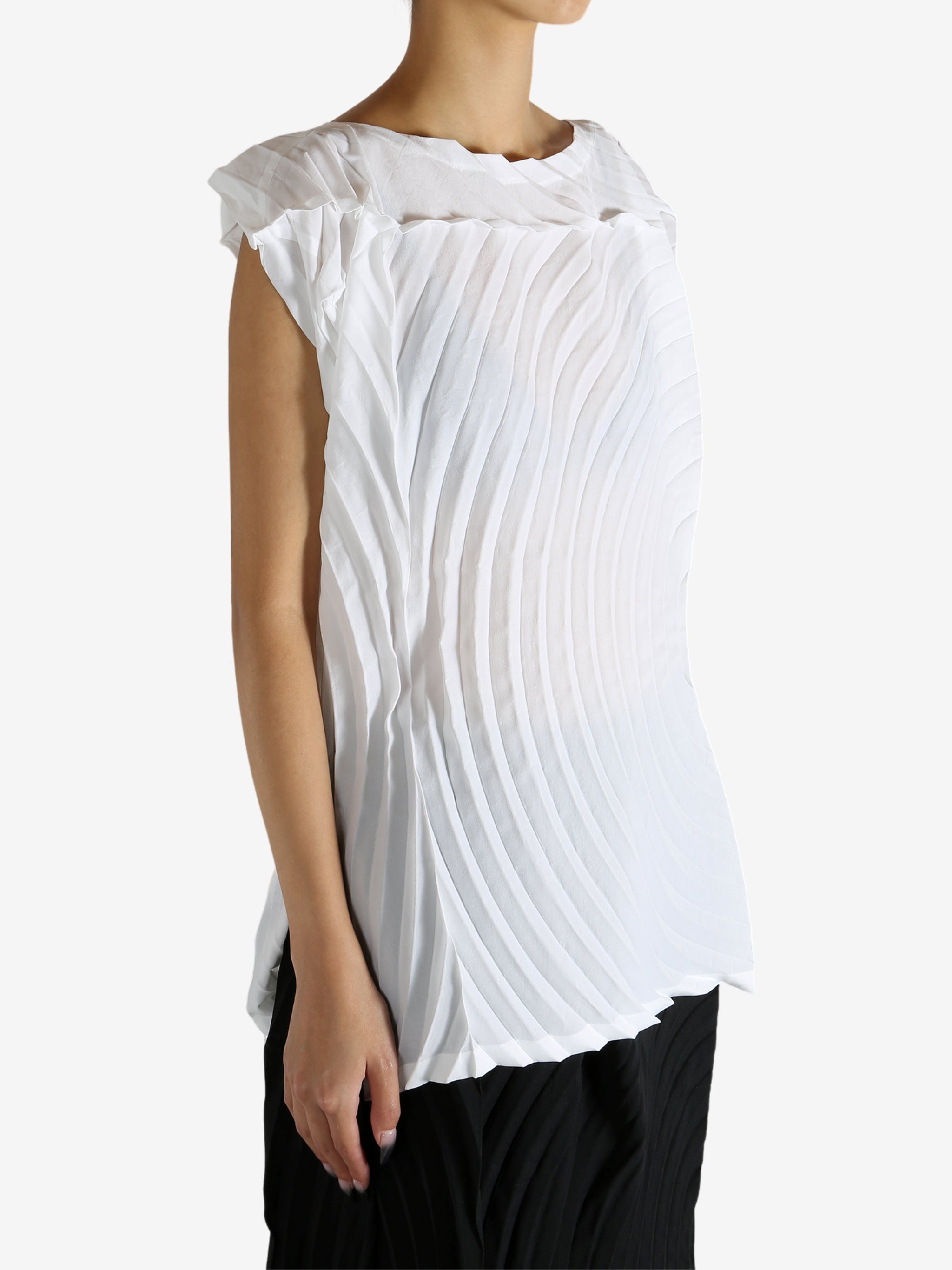 White shirt worn by a person, showing the shirt's fit