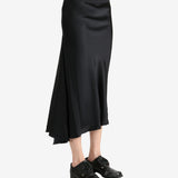 Black skirt worn by a person, showing the skirt's fit