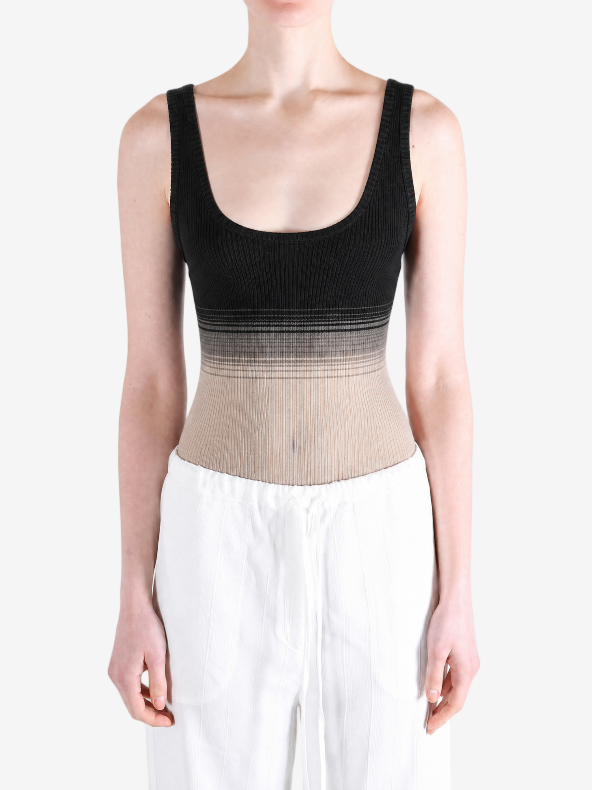 Black tops worn a person,showing the tops fit