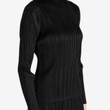 Black shirt worn by a person, showing the shirt fit