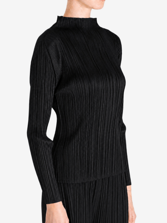 Black shirt worn by a person, showing the shirt fit
