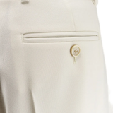 Close up of white pants, showing texture of the wool fabric