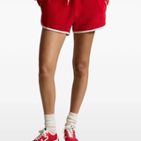 Red short worn by a person, showing the short's fit