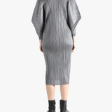 Grey dress worn by a person, showing the dress's fit