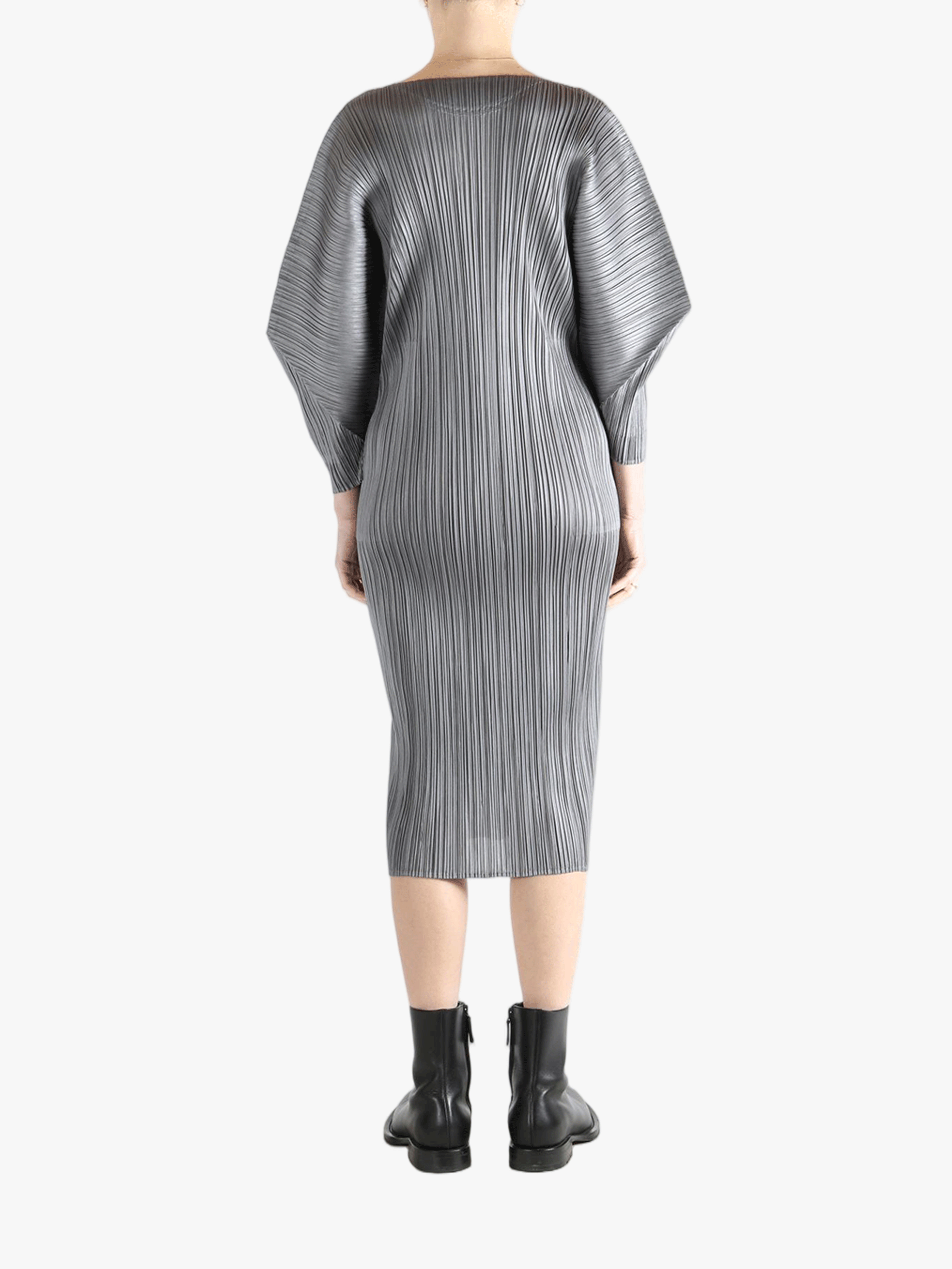 Grey dress worn by a person, showing the dress's fit