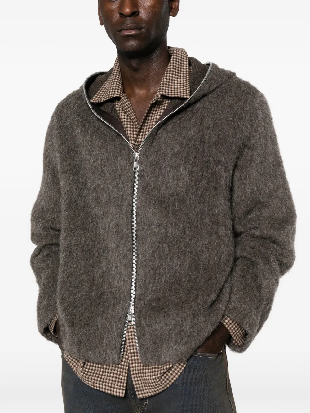 grey hoodie worn by a person, showing the hoodie fit