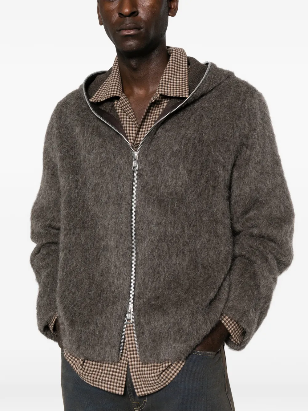 grey hoodie worn by a person, showing the hoodie fit