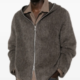 grey hoodie worn by a person, showing the hoodie fit