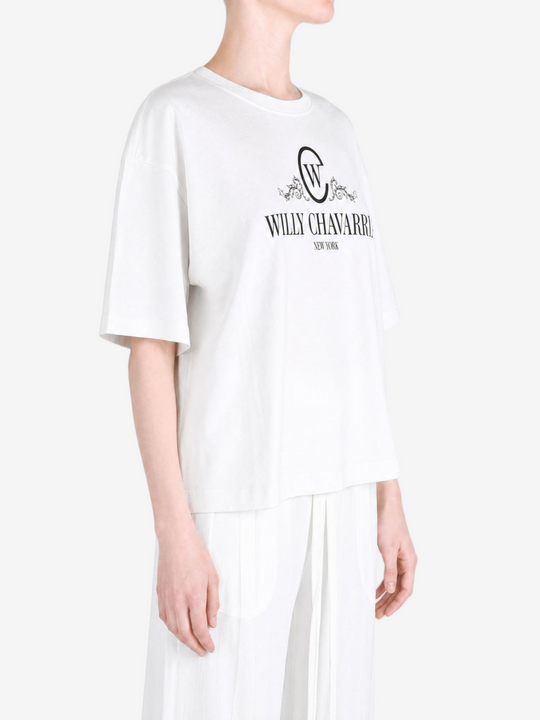 White t-shirt worn by a person, showing the t-shirt fit