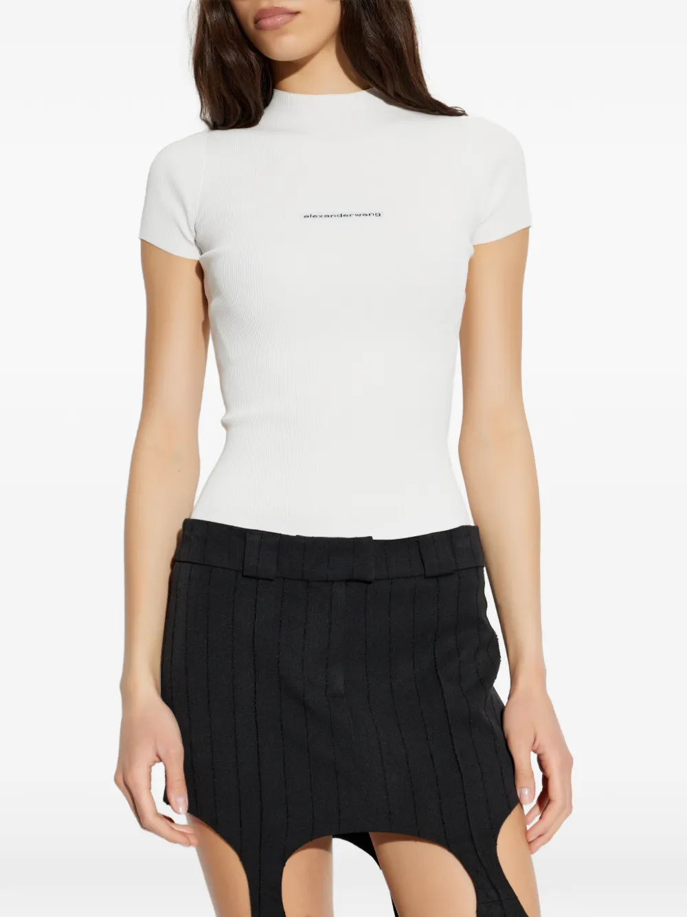 White t-shirts worn by a person, showing the t-shirts fit