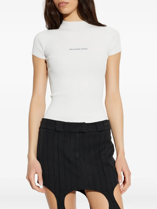White t-shirts worn by a person, showing the t-shirts fit