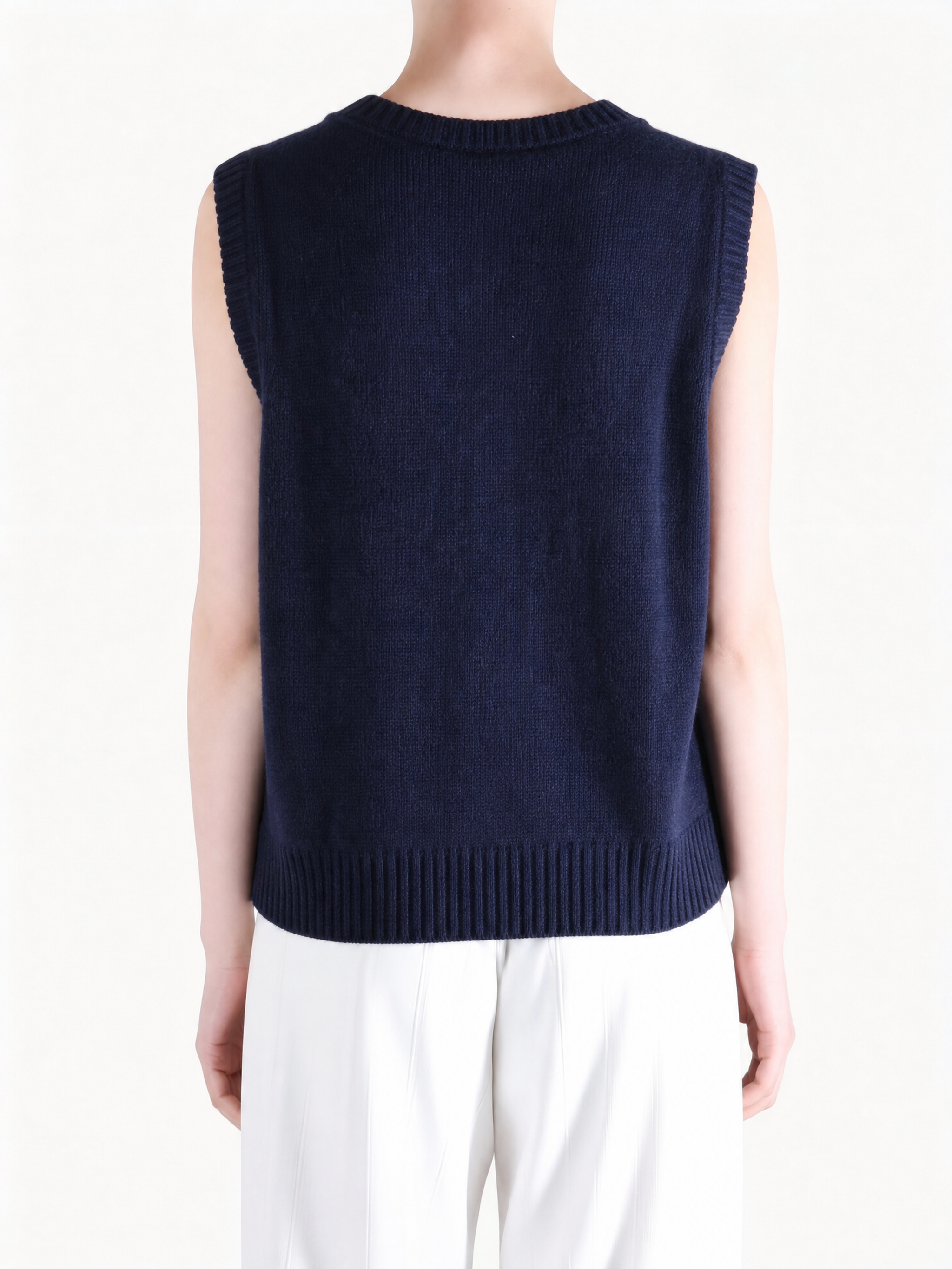 Navy top worn by a person, showing the top fit