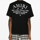 Black t-shirt, worn by a person, showing the shirt's fit