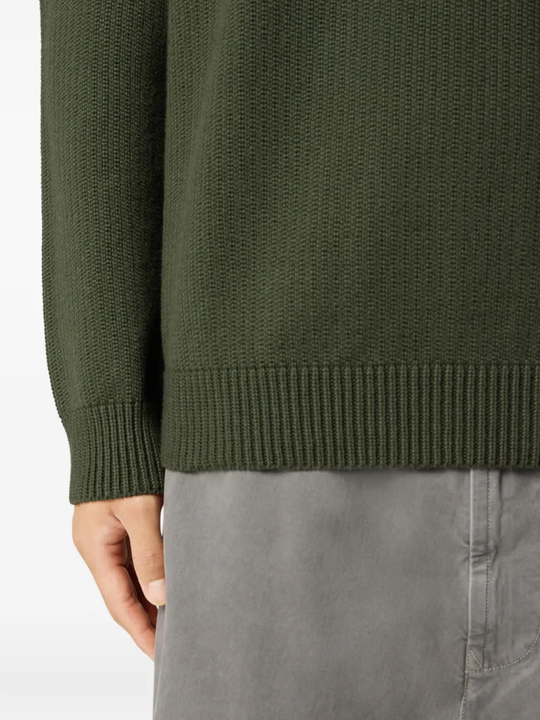 Close up of green sweat,showing texture of the cotton fabric.