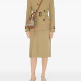 Brown bag carried by a person, showing the bag’s fit