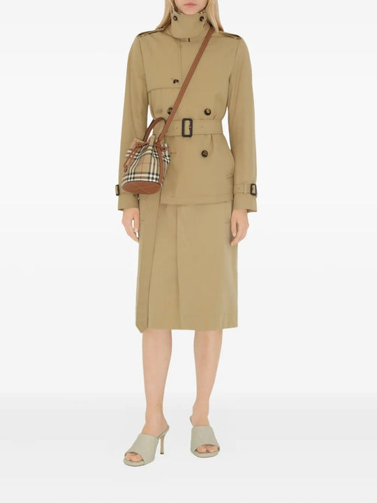 Brown bag carried by a person, showing the bag’s fit