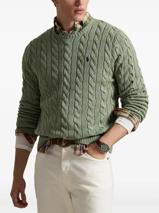 Green knitwears,worn by a person, showing the knitwears fit