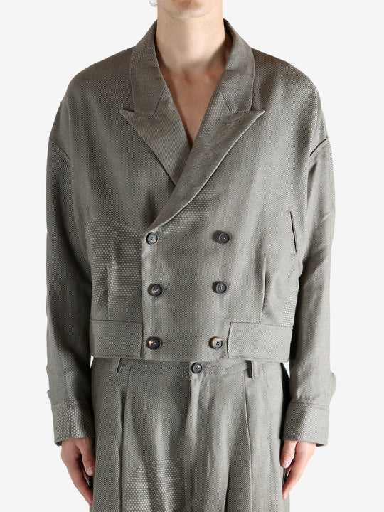 Grey jacket worn by a person, showing the jacket's fit