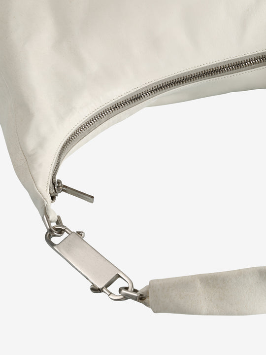 Close up of the white bag, showing texture of the leather fabric