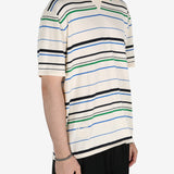 Tan shirt worn by a person, showing the shirt's fit