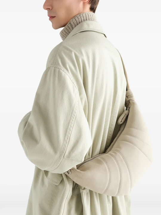 Tan bag worn by a person, showing the bag fit
