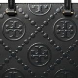 Close up of black bag, showing texture of the leather fabric
