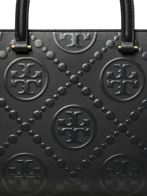 Close up of black bag, showing texture of the leather fabric