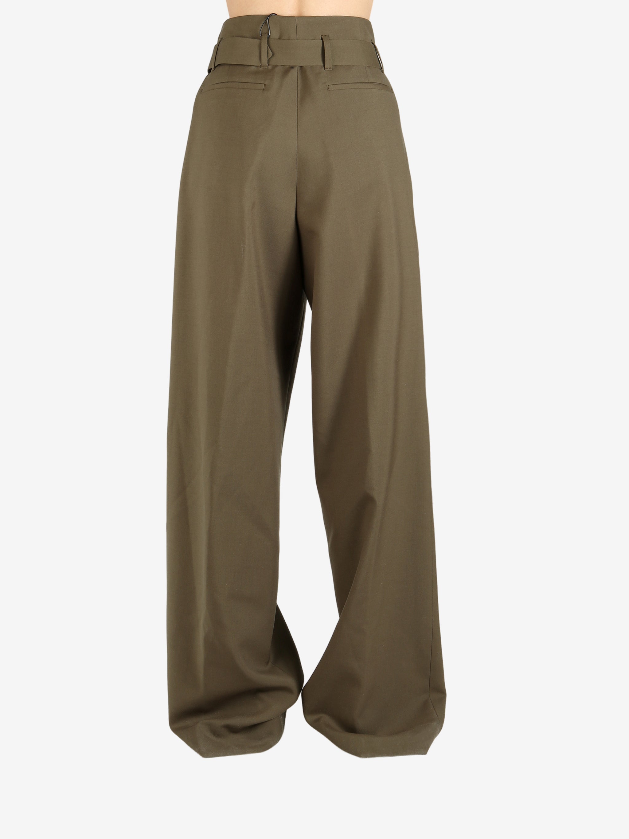 Green pant worn by a person, showing the pant's fit